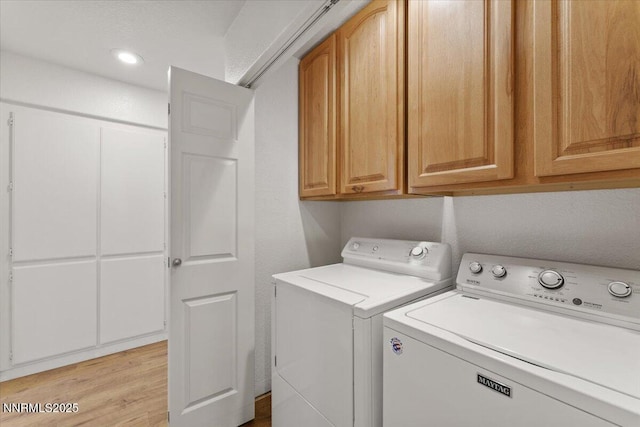 7560 Lighthouse Ln, Reno, NV 89511 - laundry room featuring cabinet space, washing machine and dryer, and light wood finished floors