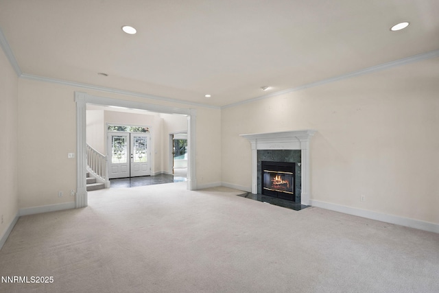 224 Foothill Meadows Ct, Genoa, NV 89411 - unfurnished living room with ornamental molding, carpet floors, a premium fireplace, stairs, and recessed lighting
