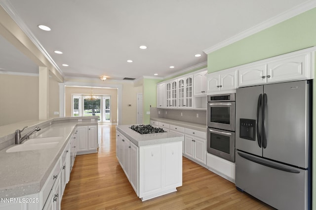 224 Foothill Meadows Ct, Genoa, NV 89411 - kitchen featuring appliances with stainless steel finishes, a chandelier, ornamental molding, light wood-style flooring, and recessed lighting