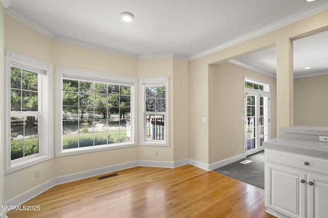224 Foothill Meadows Ct, Genoa, NV 89411 - empty room with light wood-type flooring, healthy amount of natural light, crown molding, and recessed lighting