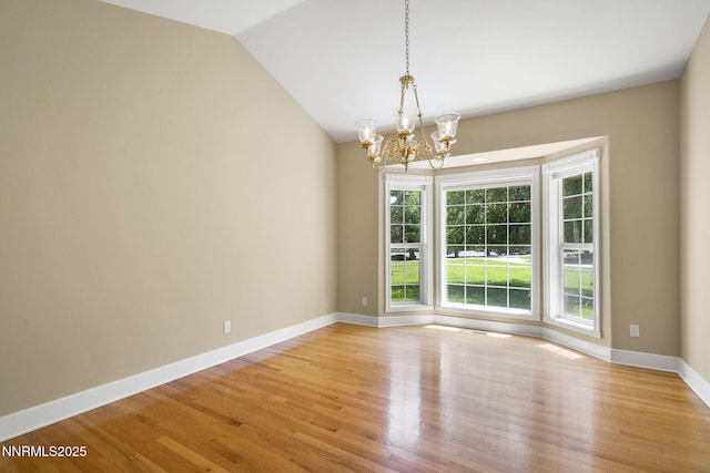 224 Foothill Meadows Ct, Genoa, NV 89411 - unfurnished room with a chandelier, light wood-type flooring, and vaulted ceiling