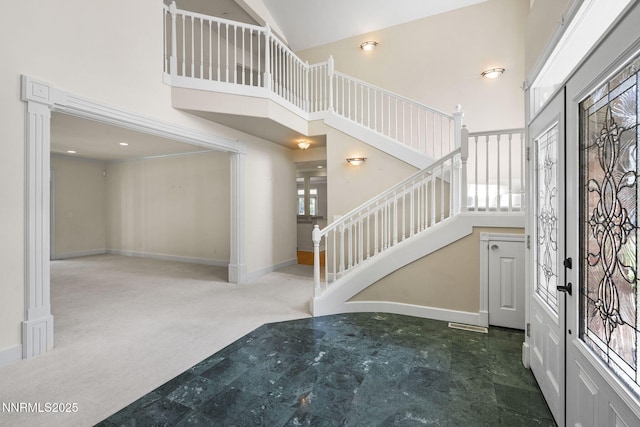 224 Foothill Meadows Ct, Genoa, NV 89411 - foyer featuring a towering ceiling, stairs, and carpet floors