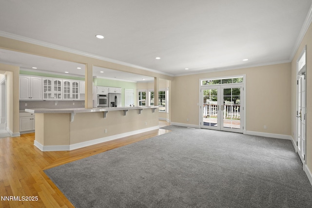 224 Foothill Meadows Ct, Genoa, NV 89411 - unfurnished living room with french doors, recessed lighting, ornamental molding, and light wood-type flooring