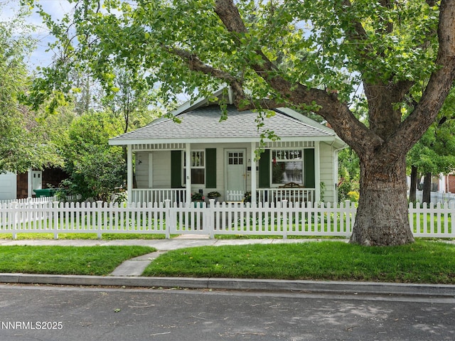 1016 Nixon Ave, Reno, NV 89509 - bungalow with covered porch, roof with shingles, and a fenced front yard