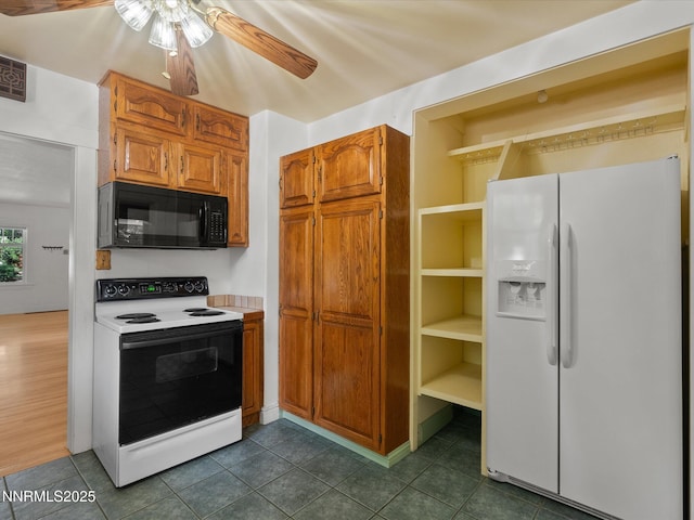 1016 Nixon Ave, Reno, NV 89509 - kitchen featuring white appliances, a ceiling fan, brown cabinetry, light countertops, and dark tile patterned flooring