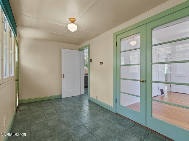 1016 Nixon Ave, Reno, NV 89509 - empty room featuring french doors, plenty of natural light, and dark tile patterned floors