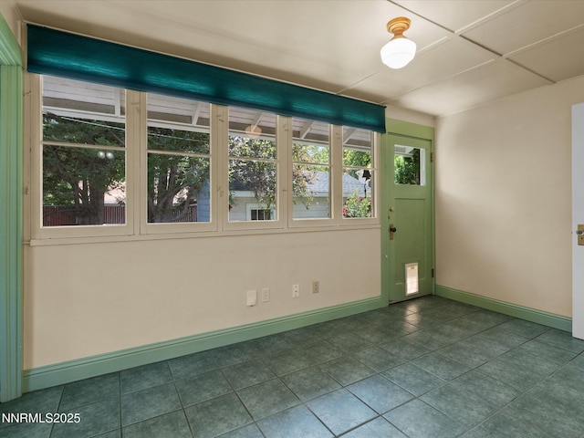 1016 Nixon Ave, Reno, NV 89509 - unfurnished room featuring baseboards and dark tile patterned floors
