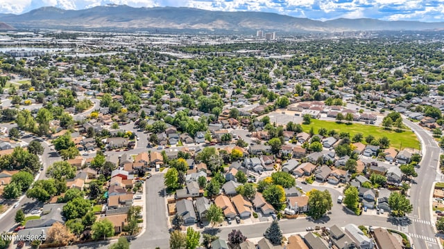 1544 Woodhaven Ln, Sparks, NV 89434 - aerial perspective of suburban area with a mountainous background