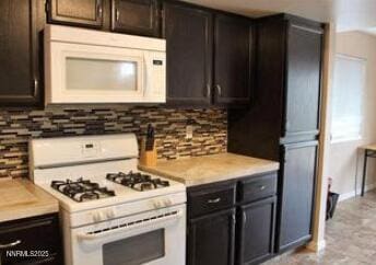 1544 Woodhaven Ln, Sparks, NV 89434 - kitchen featuring white appliances, backsplash, and light countertops