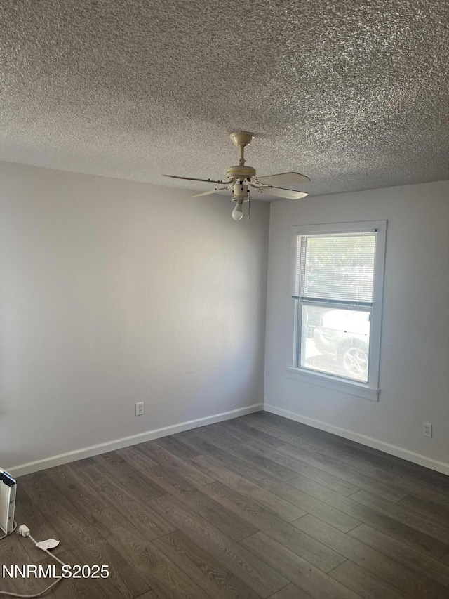1470 Franklin Ave, Lovelock, NV 89419 - unfurnished room featuring dark wood-style flooring, ceiling fan, and a textured ceiling
