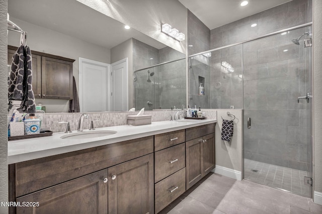 2109 Cast Iron Dr, Reno, NV 89521 - bathroom featuring double vanity, a stall shower, tile patterned floors, and recessed lighting