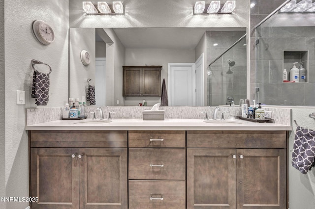 2109 Cast Iron Dr, Reno, NV 89521 - bathroom featuring double vanity, a stall shower, and a textured wall