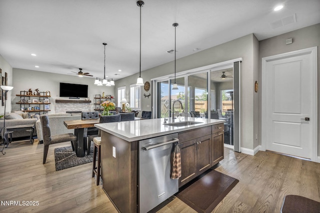 2109 Cast Iron Dr, Reno, NV 89521 - kitchen with stainless steel dishwasher, a ceiling fan, recessed lighting, light countertops, and light wood-style flooring