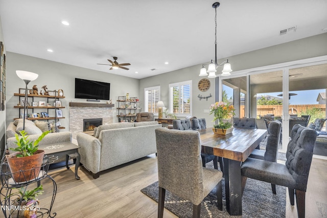 2109 Cast Iron Dr, Reno, NV 89521 - dining space with a ceiling fan, a fireplace, light wood-style flooring, and recessed lighting