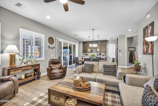 2109 Cast Iron Dr, Reno, NV 89521 - living room with light wood finished floors, ceiling fan, recessed lighting, and a chandelier