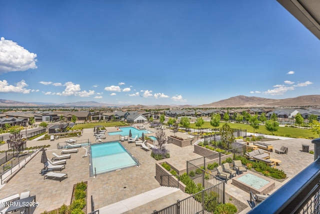 2109 Cast Iron Dr, Reno, NV 89521 - community pool featuring a residential view, a mountain view, and a patio area
