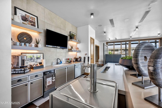 2109 Cast Iron Dr, Reno, NV 89521 - kitchen with open shelves, light countertops, backsplash, and tile walls