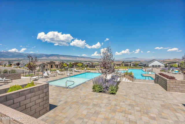 2109 Cast Iron Dr, Reno, NV 89521 - community pool with a patio area, a mountain view, and a residential view