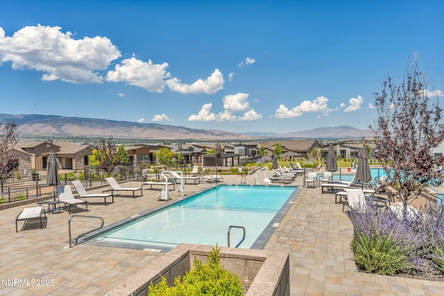 2109 Cast Iron Dr, Reno, NV 89521 - community pool featuring a mountain view, a patio area, and a residential view