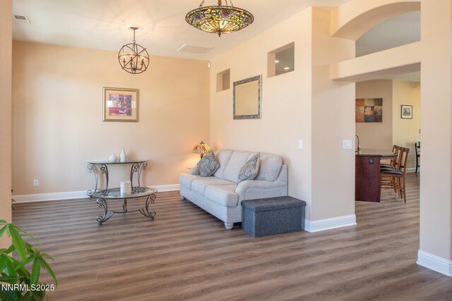 2605 Lerma Ct, Sparks, NV 89436 - living area featuring dark wood finished floors and a chandelier
