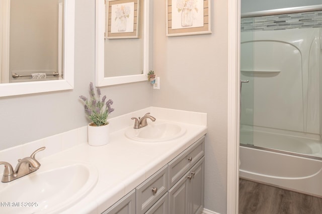 2605 Lerma Ct, Sparks, NV 89436 - full bath with double vanity, combined bath / shower with glass door, and wood finished floors