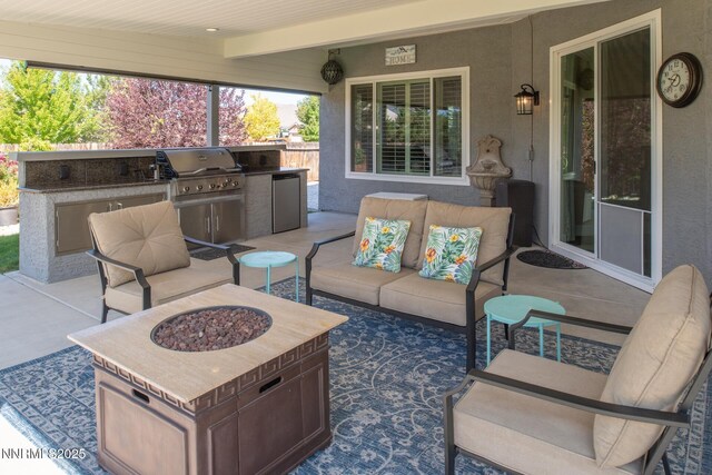 2605 Lerma Ct, Sparks, NV 89436 - view of patio / terrace with exterior kitchen and an outdoor living space with a fire pit