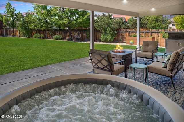 2605 Lerma Ct, Sparks, NV 89436 - fenced backyard featuring a fire pit, a hot tub, and a patio