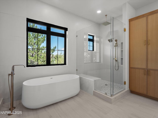 3662 Spirit Bluff Ct, Reno, NV 89511 - bathroom featuring a shower stall, a soaking tub, tile patterned flooring, and recessed lighting