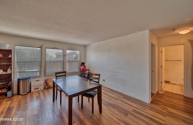 9698 Canyon Meadows Dr, Reno, NV 89506 - dining space featuring wood finished floors and a textured ceiling