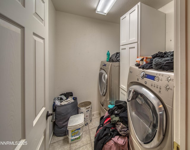 9698 Canyon Meadows Dr, Reno, NV 89506 - laundry room featuring cabinet space, washer and dryer, and tile patterned flooring