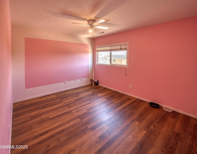 9698 Canyon Meadows Dr, Reno, NV 89506 - spare room with ceiling fan, dark wood-style floors, and a textured ceiling