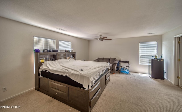 9698 Canyon Meadows Dr, Reno, NV 89506 - bedroom featuring light colored carpet, multiple windows, and ceiling fan