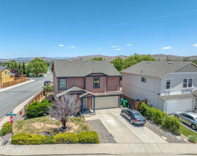 9698 Canyon Meadows Dr, Reno, NV 89506 - view of front facade featuring a mountain view, an attached garage, concrete driveway, and roof with shingles
