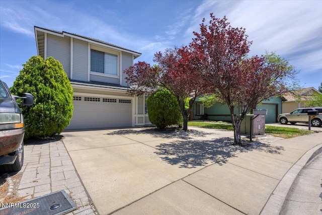 1592 Reno View Dr, Reno, NV 89523 - obstructed view of property featuring a garage and driveway