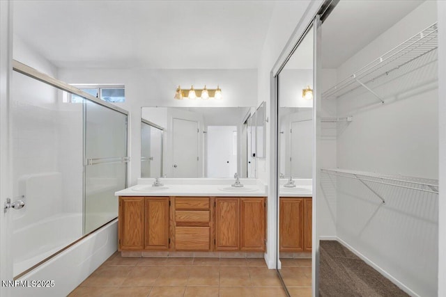 1592 Reno View Dr, Reno, NV 89523 - bathroom with combined bath / shower with glass door, double vanity, tile patterned floors, and a spacious closet