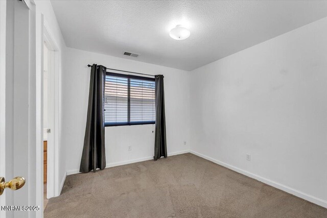 1592 Reno View Dr, Reno, NV 89523 - spare room with carpet and a textured ceiling
