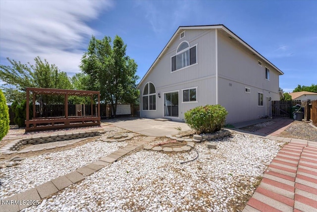 1592 Reno View Dr, Reno, NV 89523 - rear view of property featuring a patio, a fenced backyard, a gate, and a pergola