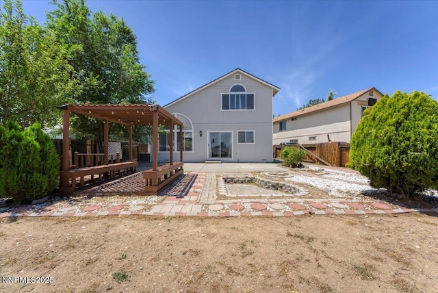 1592 Reno View Dr, Reno, NV 89523 - back of property with a patio, a fenced backyard, and a pergola