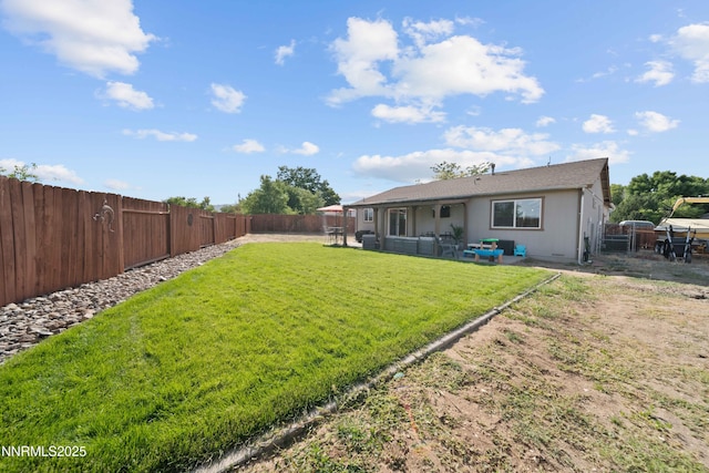 6340 E Choctaw Ct, Sun Valley, NV 89433 - fenced backyard featuring a patio area and outdoor lounge area