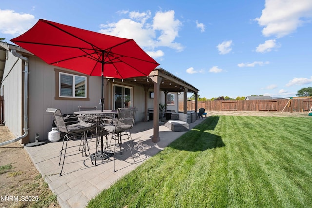 6340 E Choctaw Ct, Sun Valley, NV 89433 - back of property with a fenced backyard, a patio area, and an outdoor hangout area
