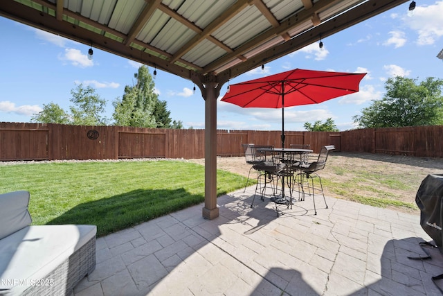 6340 E Choctaw Ct, Sun Valley, NV 89433 - fenced backyard featuring a patio area and outdoor dining area