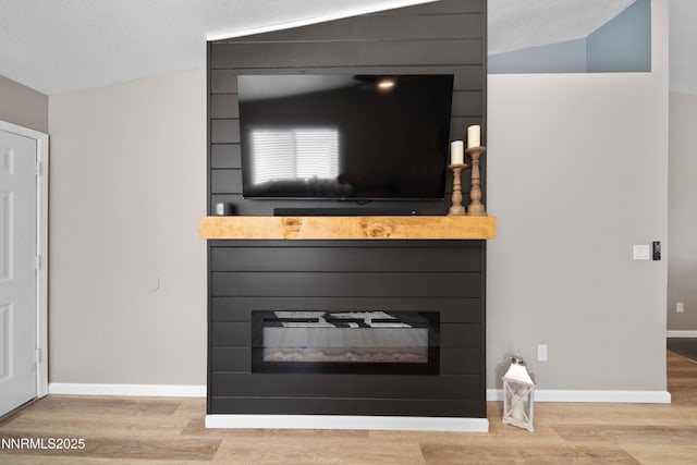 6340 E Choctaw Ct, Sun Valley, NV 89433 - detailed view of a large fireplace and wood finished floors
