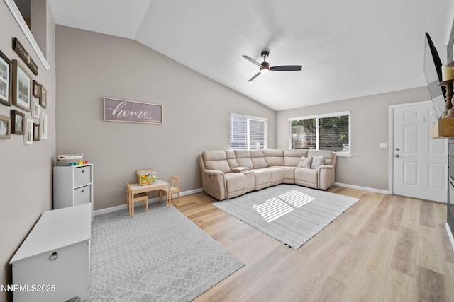 6340 E Choctaw Ct, Sun Valley, NV 89433 - living room featuring ceiling fan, lofted ceiling, and light wood-style flooring