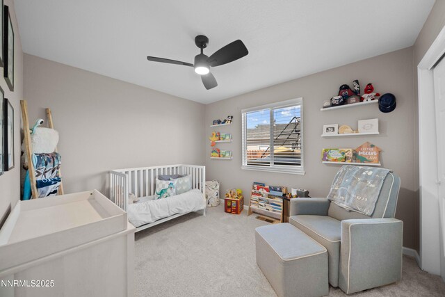 6340 E Choctaw Ct, Sun Valley, NV 89433 - bedroom with carpet flooring, a nursery area, and a ceiling fan