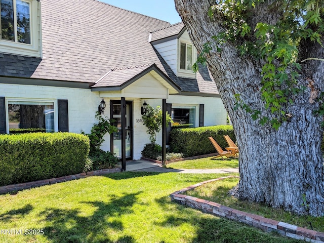 1640 Liston Ave, Reno, NV 89502 - view of front of house with a front lawn and a shingled roof
