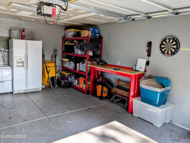 1640 Liston Ave, Reno, NV 89502 - garage with white refrigerator with ice dispenser and a garage door opener