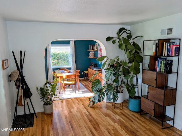 1640 Liston Ave, Reno, NV 89502 - dining area featuring arched walkways and wood finished floors