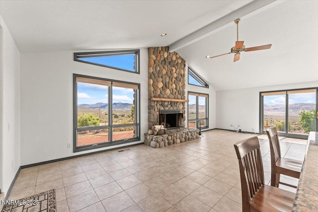 5455 Wild Horse Rd, Reno, NV 89510 - unfurnished living room featuring beam ceiling, a stone fireplace, tile patterned floors, a ceiling fan, and high vaulted ceiling