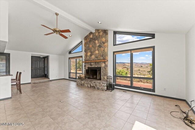 5455 Wild Horse Rd, Reno, NV 89510 - unfurnished living room with beamed ceiling, ceiling fan, high vaulted ceiling, a fireplace, and light tile patterned floors