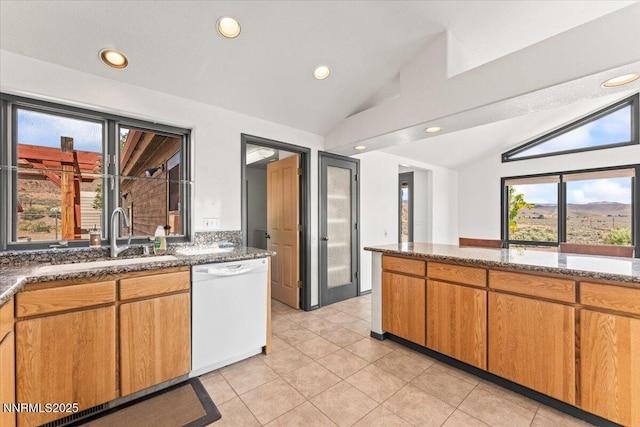 5455 Wild Horse Rd, Reno, NV 89510 - kitchen with dishwasher, vaulted ceiling, recessed lighting, light tile patterned floors, and dark stone countertops